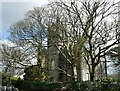 Trees partly hide the abandoned church of All Saints, St Day in TR16 5PB