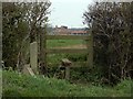 A stile and public footpath to Woodhatch in CM16 7PU