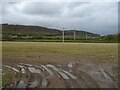 Stubble field and power lines near Hendre-bach in LL22 9BE