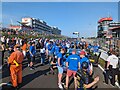 People swarm onto the starting grid of the race in TN15 6DY