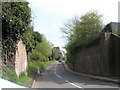 View up Bepton Lane through old railway bridge in GU29 9RJ