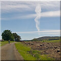 Reaching for the heavens: A vertical contrail pierces the clouds in AB34 5PT