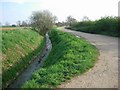Ditch and access road in CB24 4SW