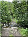 Ford on rough track crossing Blackton Beck in DL12 0AR