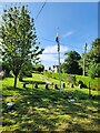 Looking from the churchyard towards the British Legion Garden of Remembrance in SN11 0QB
