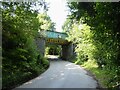 Railway bridge over road from golf course in SK7 6PR