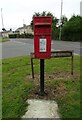Elizabeth II postbox on Church Lane, St Martins in SY11 3EU