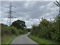 Pylon by country lane by railway bridge in WR9 0PY