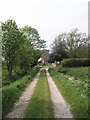 Looking up track from the Selsey Road towards St George's Church, Donnington in PO20 7PN