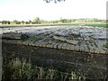 Hard-standing of concrete railway sleepers in a farm field in SY6 7HZ
