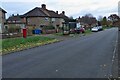 Bus shelter and George VI postbox on Ivy Road in NN16 0PG