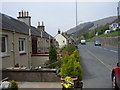 Cottages at the side of the A72 road in Walkerburn in EH43 6AY