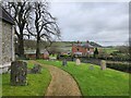 Looking from Huish Churchyard over to Manor Farm in SN8 4JW