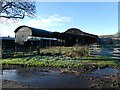 Old black corrugated barns at Pool House farm in SY4 4HG