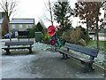 Benches with poppies by Blenheim Way in WF10 5GW