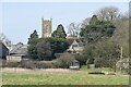 Looking past Church Farm to the church at Kilmington in BA12 6RD