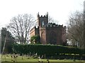 Church viewed from a footpath near Longford in TF10 8JY