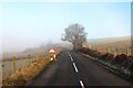 The B827 climbs into morning mist in FK15 9LL