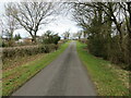 Minor road at Craggs and High Brackenthwaite Farms in CA7 8AR