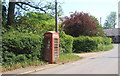 Village street and old telephone box, Market Weston in IP22 2PF