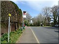 Bus stop on Woodcote Side in KT18 7BZ