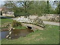 A bridge over Thackers Lane, with the stream flowing onto the River Witham in LN4 1PS