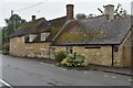 Stone house beside The Street at Latton in Latton