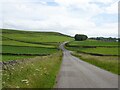 Minor road approaching  junction, Wormhill in Wormhill