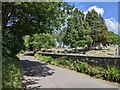 Cemetery and cyclist on the edge of Evercreech in BA4 6HU