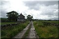 Craven Ridge Lane passing a cottage in BD24 0DY