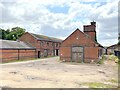Red brick farm buildings at Hardwicke Farm in SY4 3DL