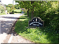 Ugglebarnby village sign in YO22 5BZ