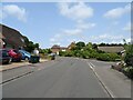 Knockwood Road junction with Summer Close in TN30 7DR