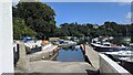 A slipway and pontoon in Porth Navas in TR11 5RL