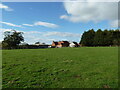 Grass field and the rear of The Gables Farm, Little Carlton in NG23 6BX