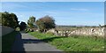 Cotswold stone walls, road north of Compton Abdale in GL54 4DP