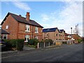 Old and new housing on Lacey Green in SK9 4DQ
