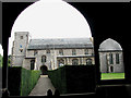 The church of All Saints - view through lych gate in Thornham