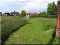 View back to road from St Edmund, Forncett End, Norfolk in Tacolneston