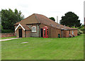 Village hall and red telephone box in Edgefield