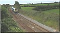 An Arriva Wales train approaching from the Holyhead direction in LL60 6LP