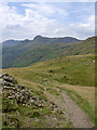 The path towards Swinescar Pike with the Langdale Pikes beyond in LA22 9JS