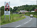 Roadsigns at Twechar, canal bridge in the distance in G65 9QJ