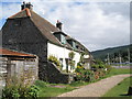 Path past the beachside cottages at Porlock Weir in TA24 8PE