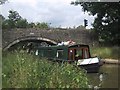Narrowboat negotiating bridge 228 on the Oxford Canal in OX5 1SS