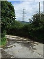 Pylon and junction of land and entrance to Bryn Cynan Farm in CF34 9RU