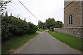 Road past All Saints, Boughton, Norfolk in Wissey Ward