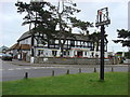 Thorpeness village sign and Thorpeness Brasserie & Emporium in IP16 4NW