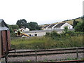 Looking across from the platform at the station to the pub garden at Washford in TA23 0PG